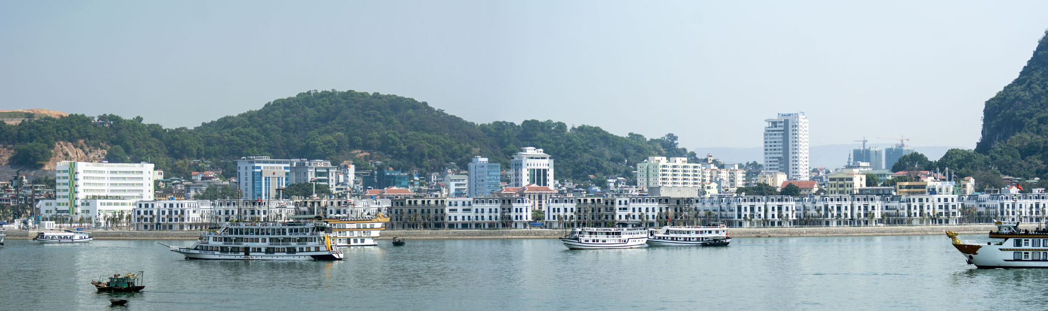 Halong Bay, View of the township; Sailing by